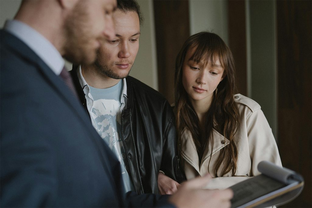 Auxilium Mortgage - Couple meeting with mortgage broker to go over mortgage details, how do mortgage brokers in BC get paid